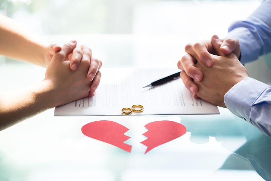 photo of a couple going through a divorce, meeting with a family lawyer at Tarrabain Law for compassionate and professional legal advice
